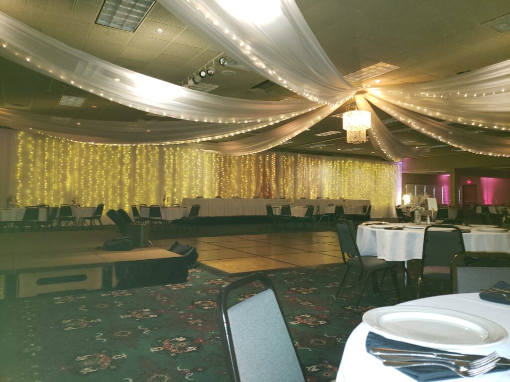 Ceiling-Draping-pink-up-lighting-light-backdrop-and-chandelier